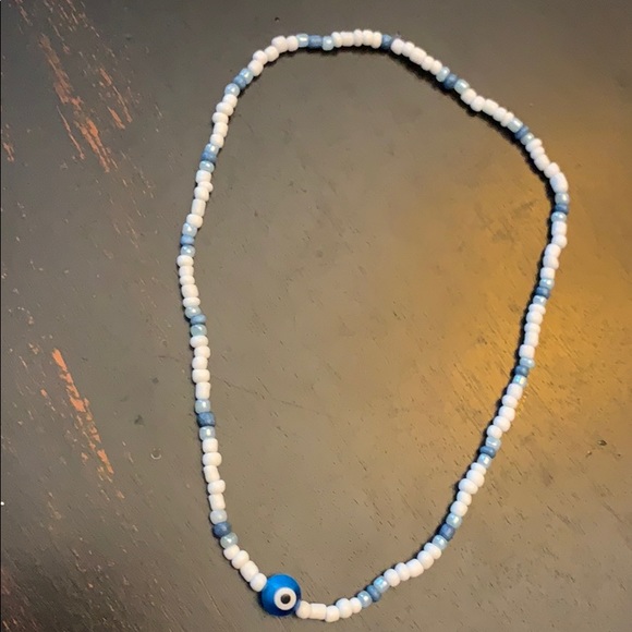 Jewelry - A stretchy stringed, beaded necklace